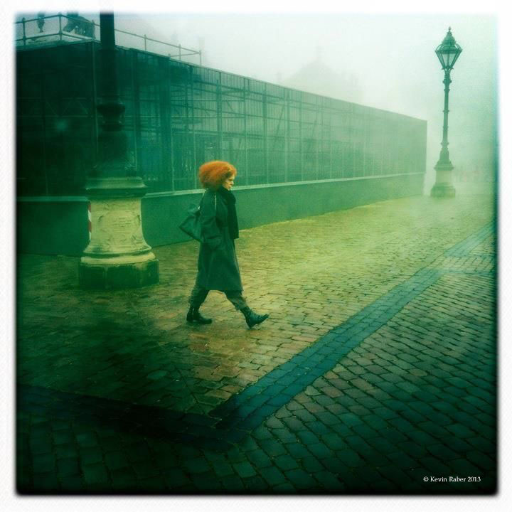 Woman walking in fog, Copenhagen, Denmark